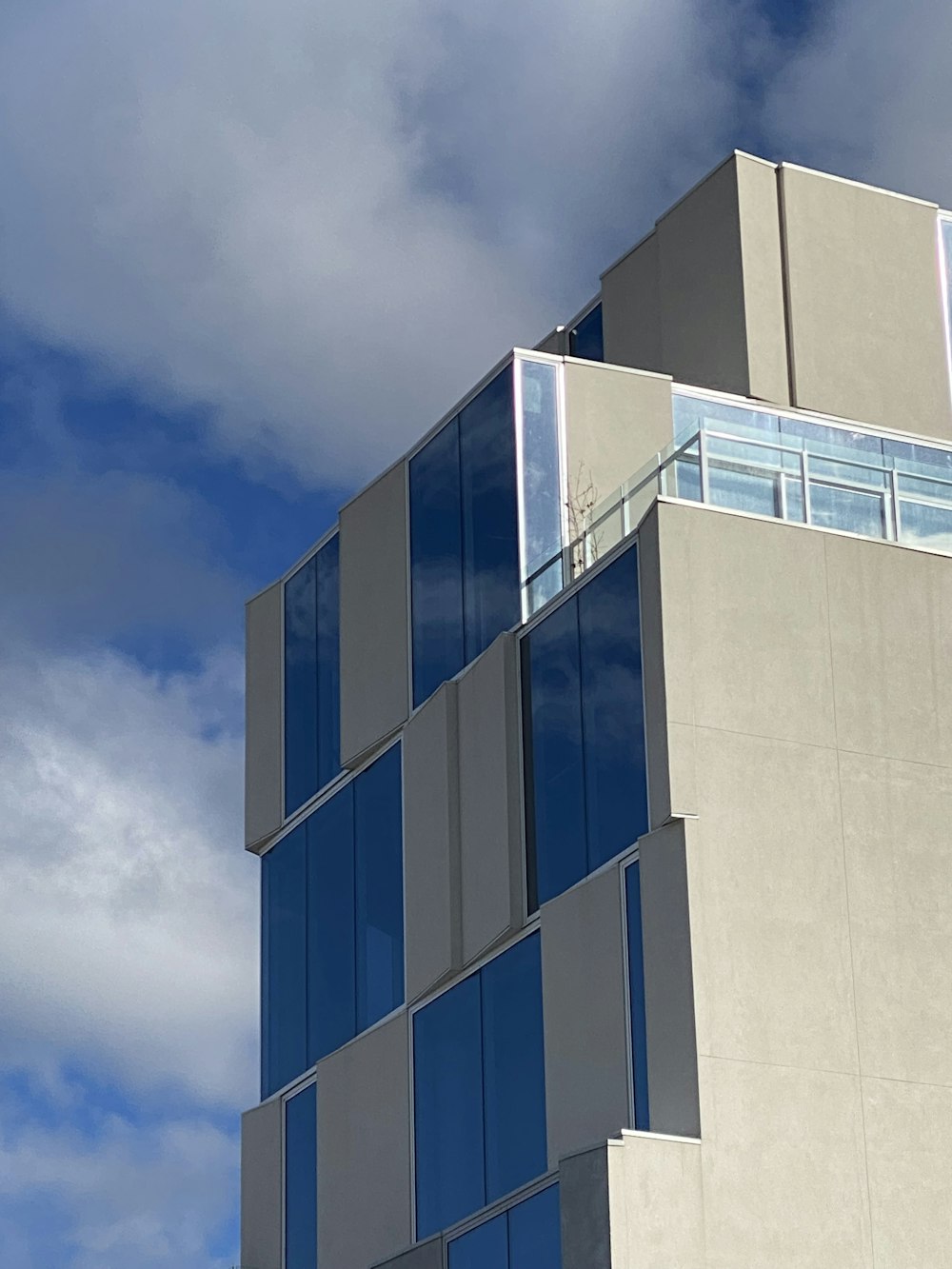 blue and white concrete building under blue sky