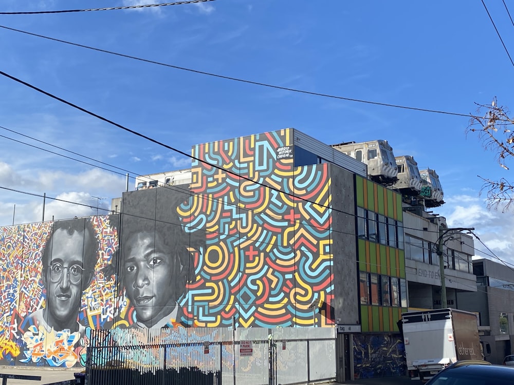 blue yellow and red graffiti on wall