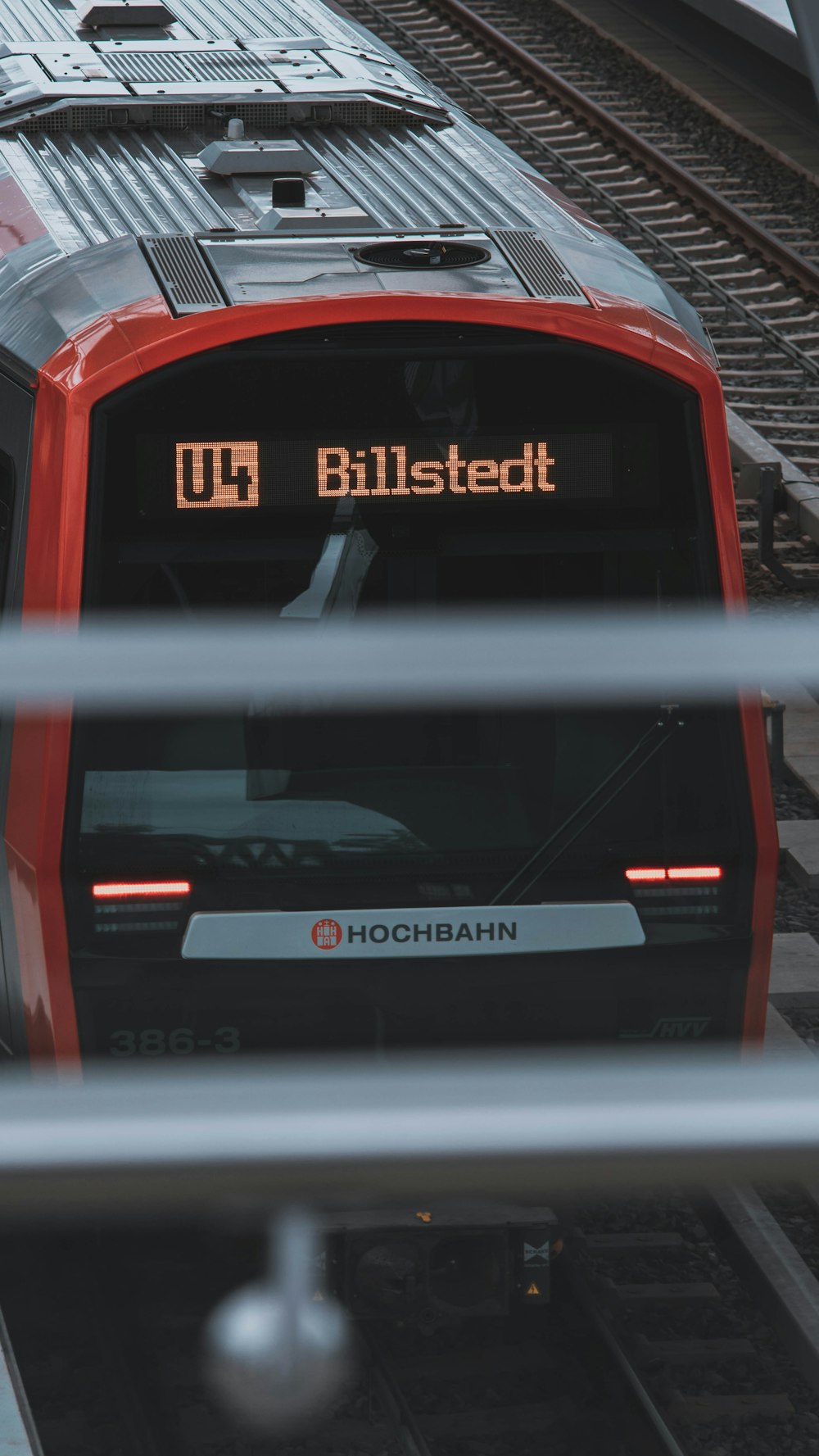 red and black car in a city street