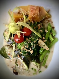 A vibrant plate of a quick, original recipe featuring fresh vegetables and a tasty sauce