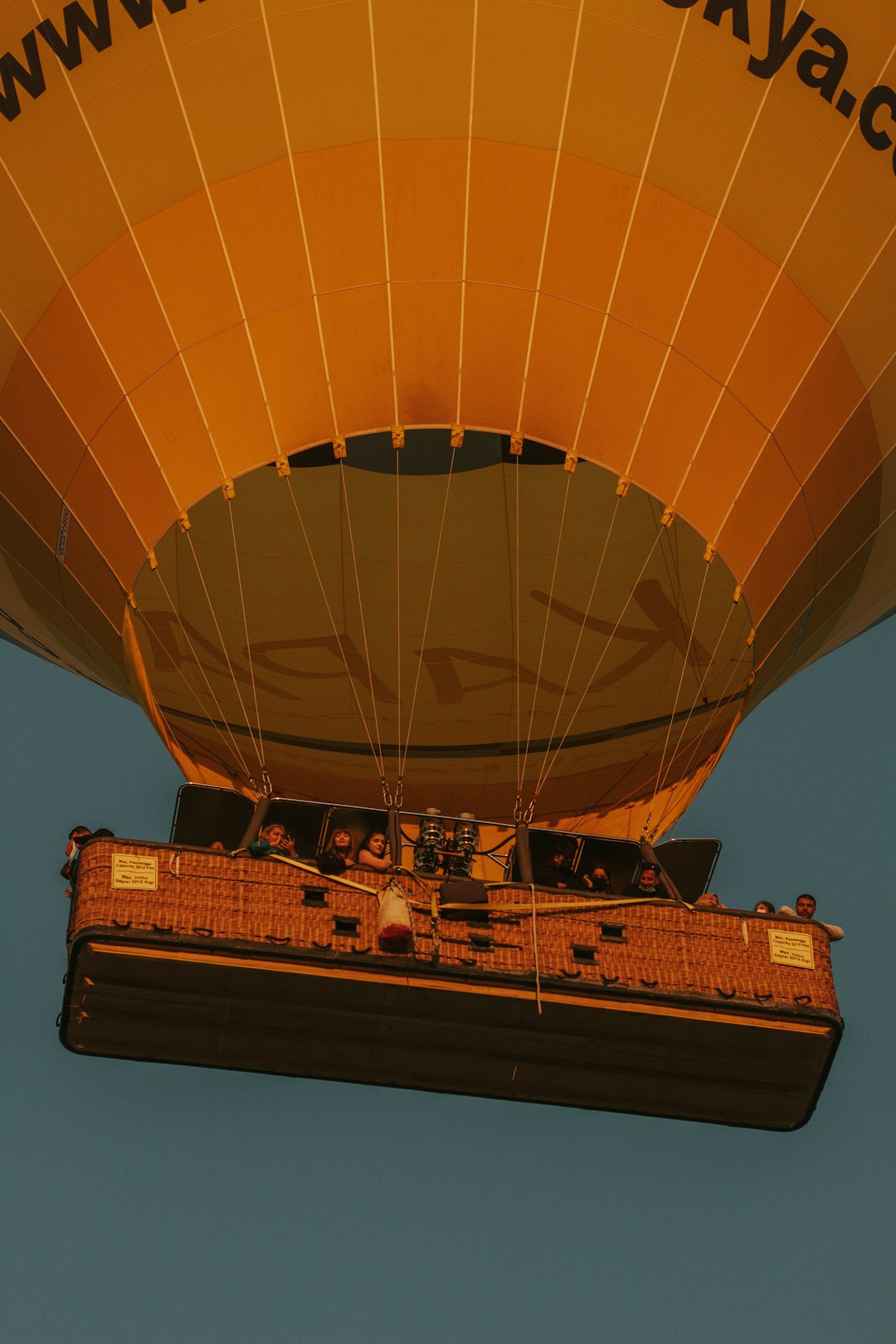 brown hot air balloon under blue sky during daytime