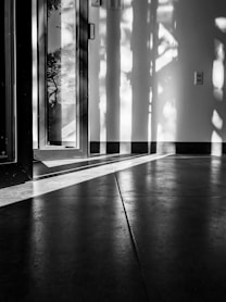 grayscale photo of glass window