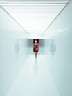 woman in red dress standing on white floor