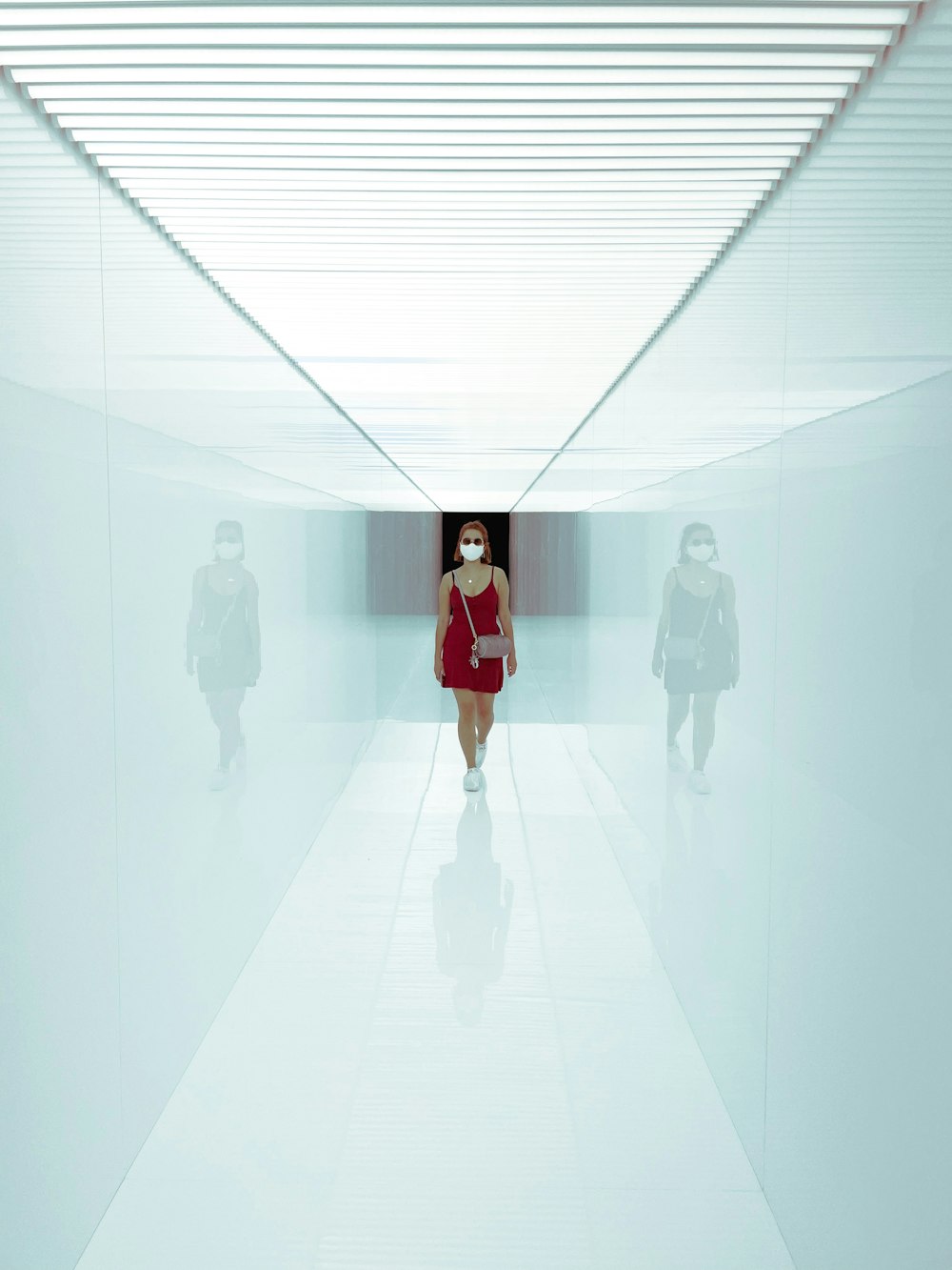 woman in red dress standing on white floor