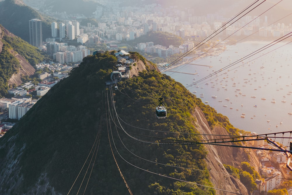 cable cars over the city during daytime