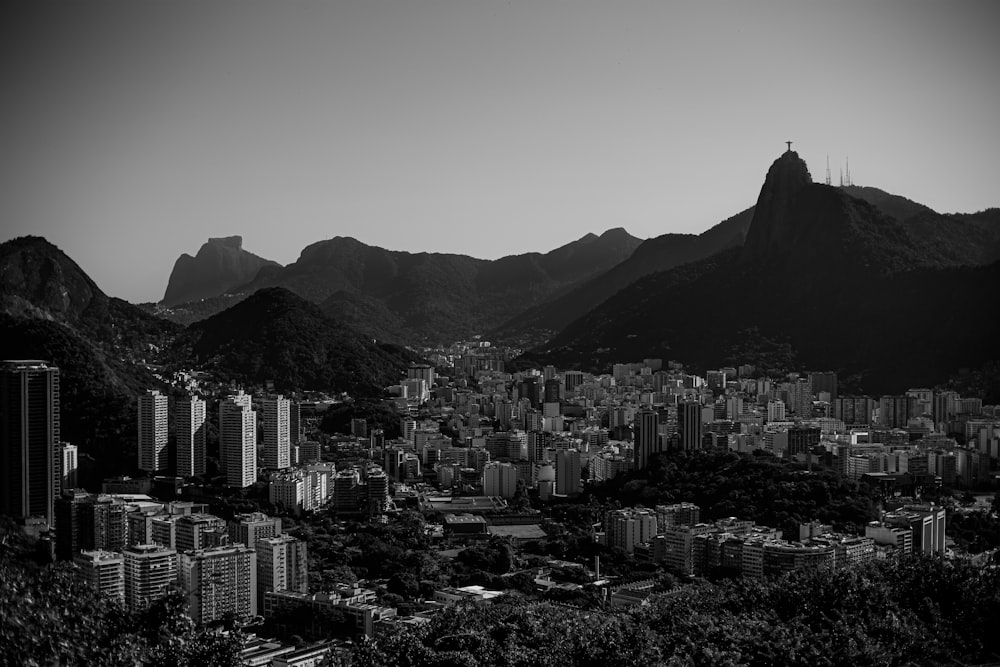 city buildings near mountain during daytime