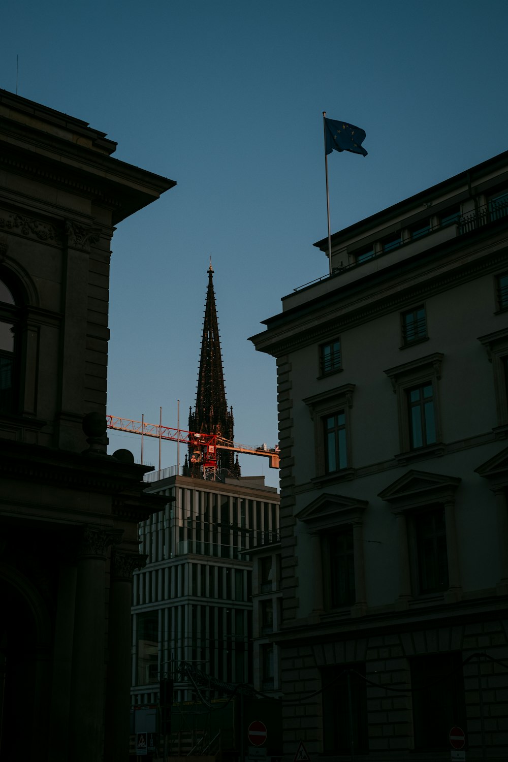 brown concrete building with flag of us a during daytime