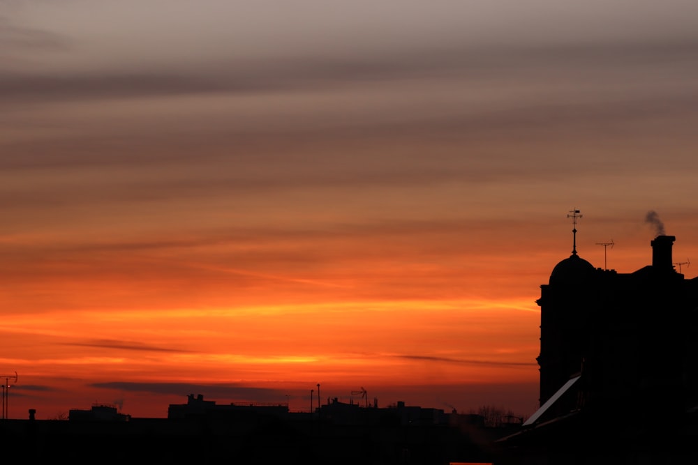 silhouette of building during sunset