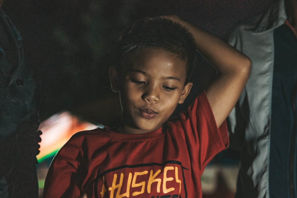 boy in red and yellow crew neck t-shirt