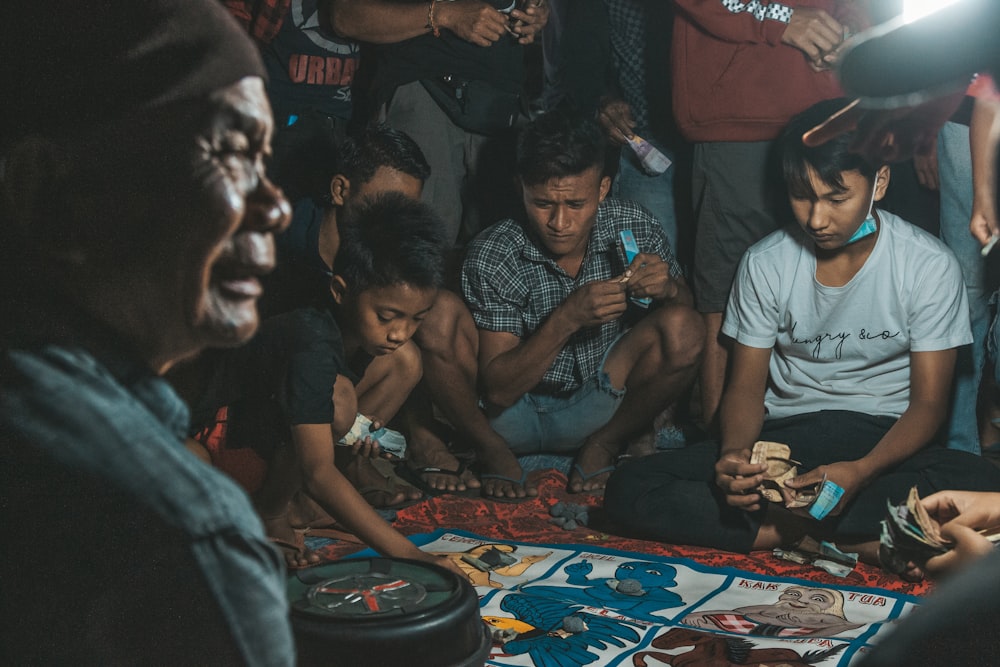 people sitting on floor inside room