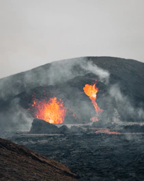 A volcanic eruption with molten lava flowing fiercely.