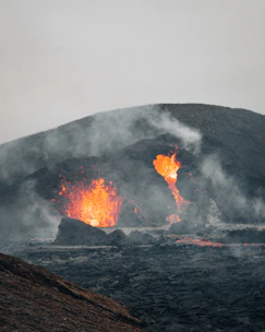 A volcanic eruption with molten lava flowing fiercely.