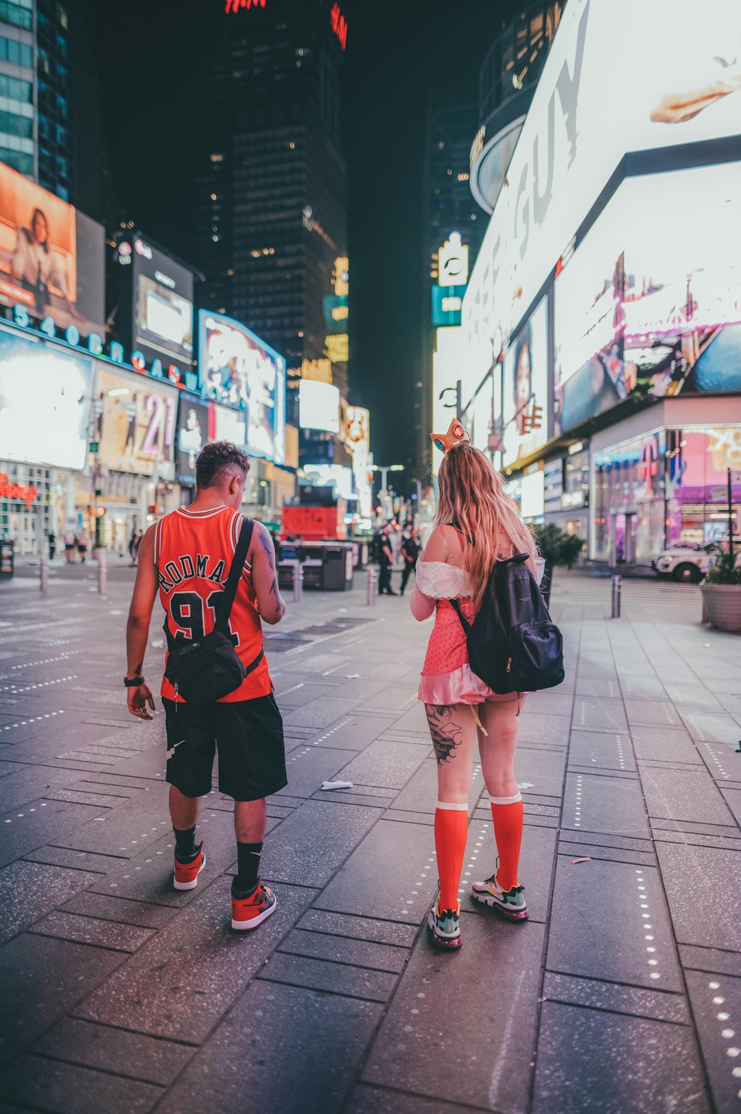 man in red and white nike crew neck t-shirt and woman in red and black