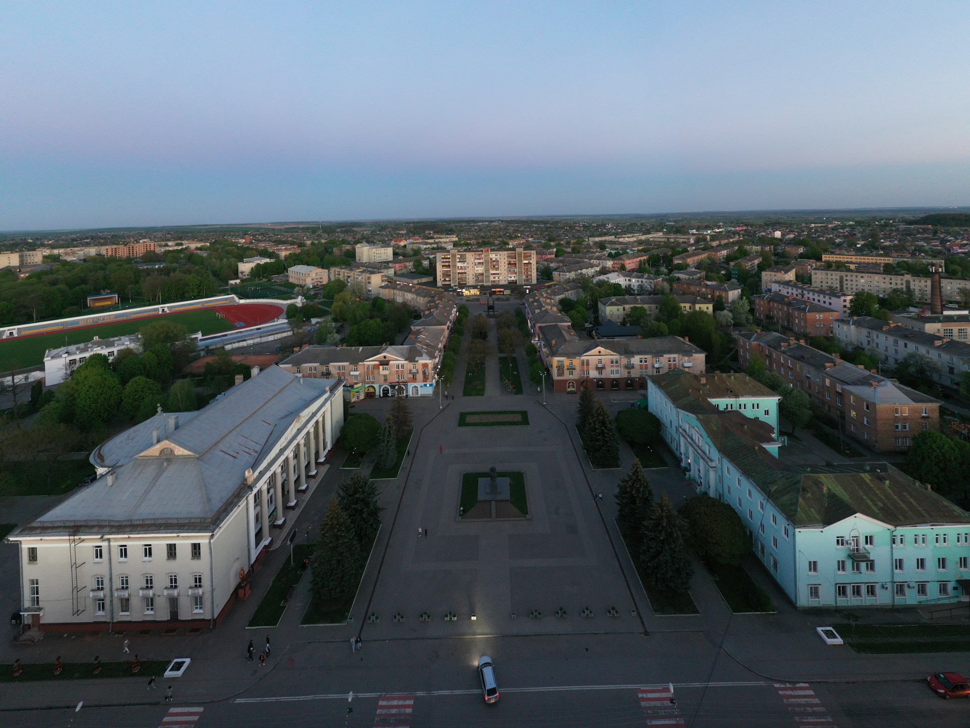 woman wearing yellow long-sleeved dress under white clouds and blue sky during daytime