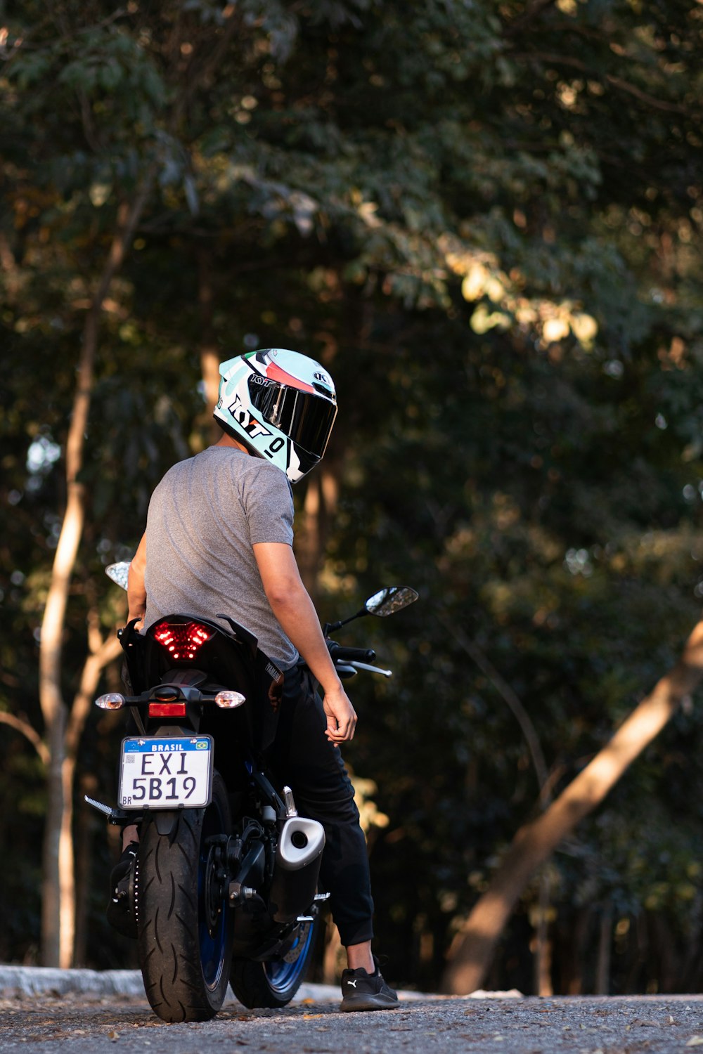Man in white shirt riding motorcycle photo – Free Helmet Image on Unsplash