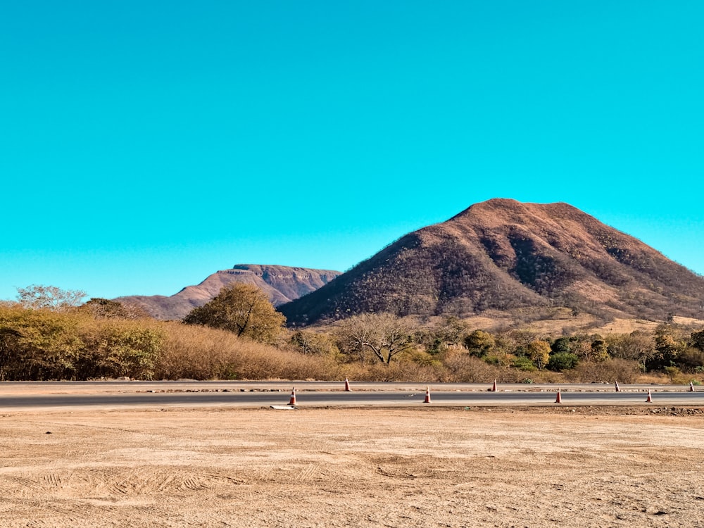 green and brown mountains under blue sky during daytime