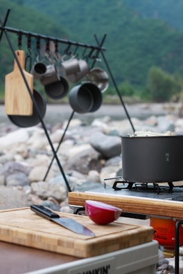 black cooking pot on brown wooden chopping board