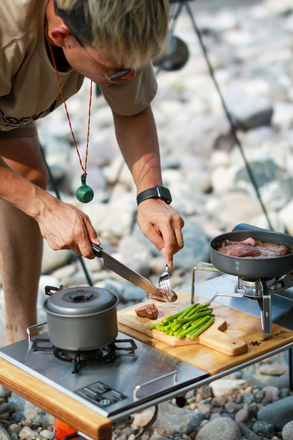 person holding green vegetable and fork