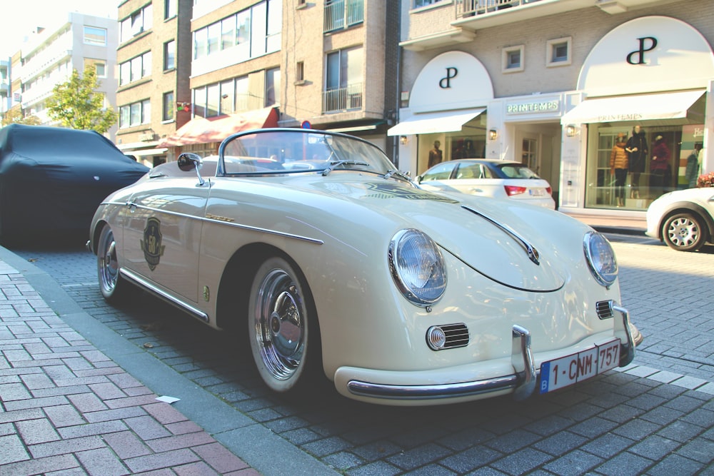 silver porsche 911 parked on street during daytime