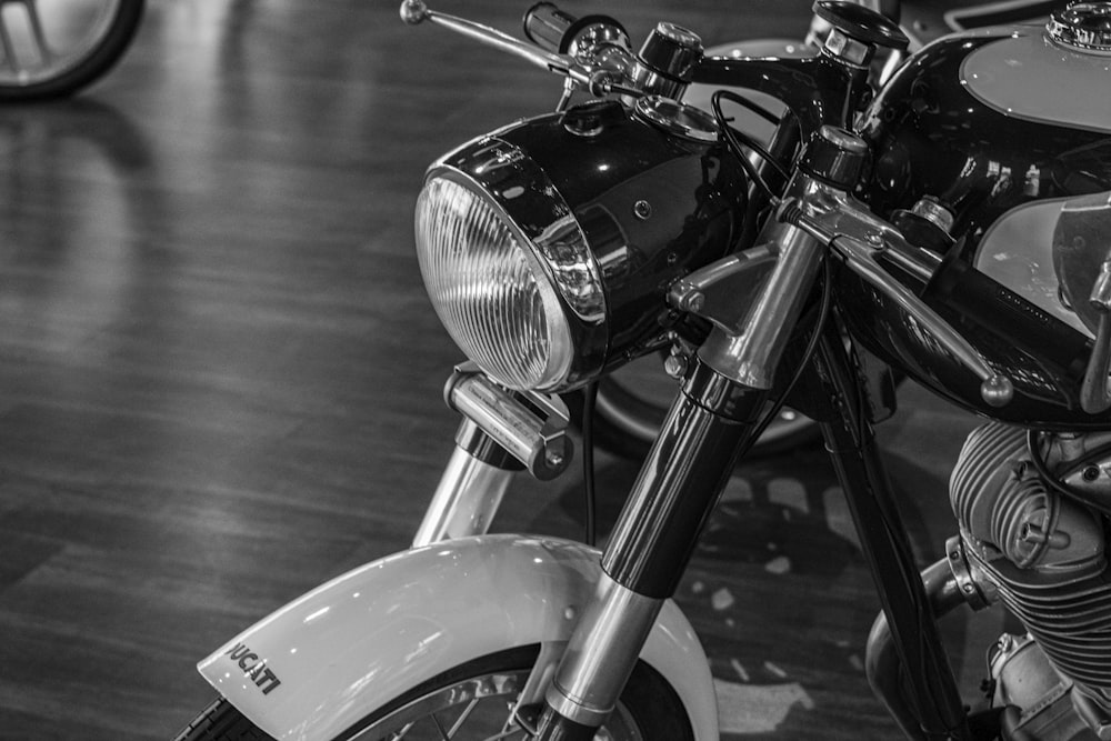 grayscale photo of motorcycle on road