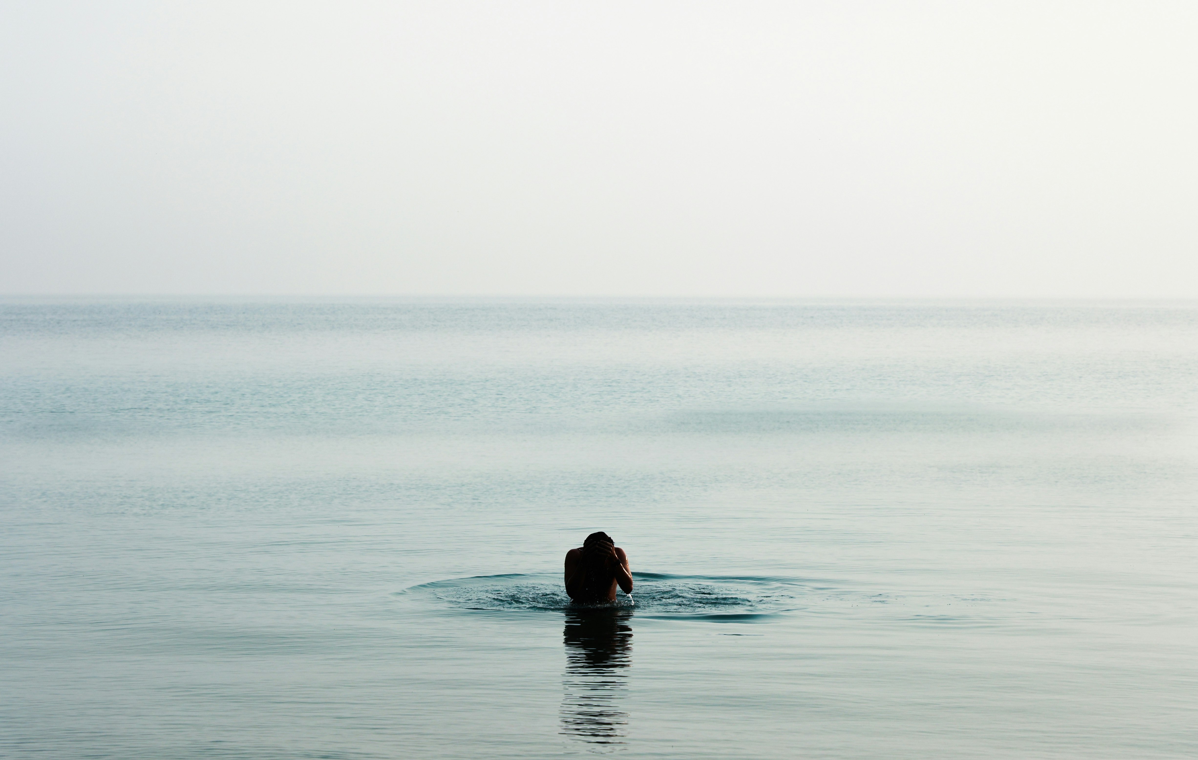 woman in black dress in water