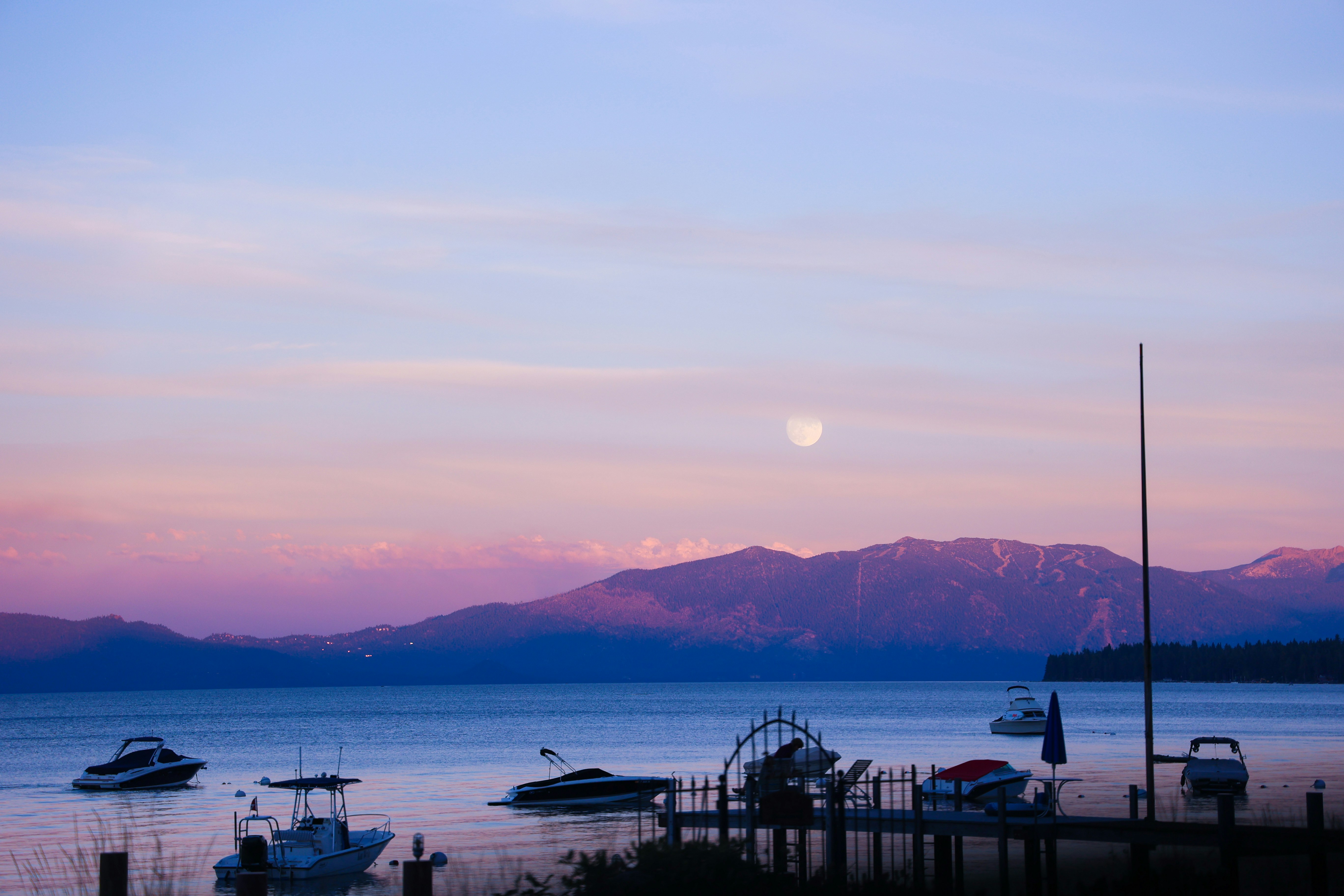 Scenic view of Incline Village homes near Lake Tahoe with pine trees and lake in the background