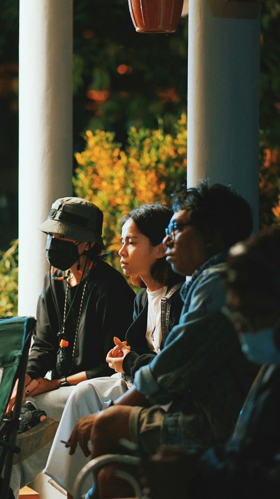 man in black jacket sitting beside woman in black jacket