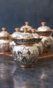 white and blue floral ceramic jar