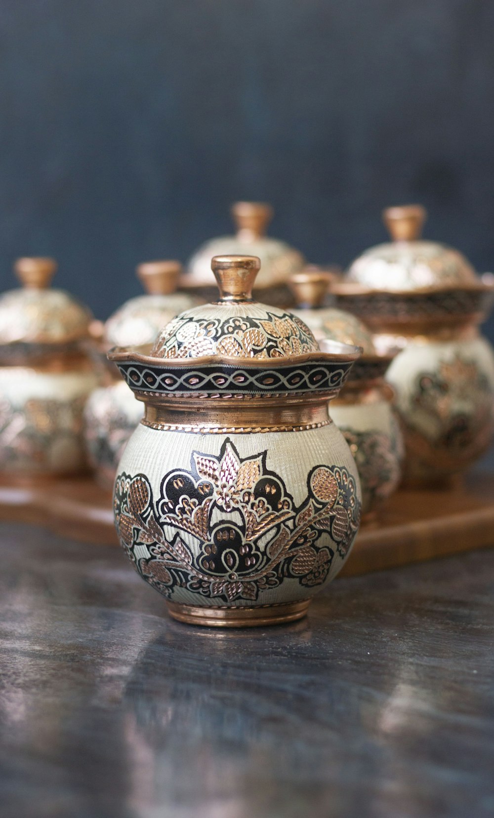 white and blue floral ceramic jar