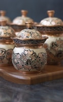 white and blue floral ceramic jar