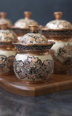 white and blue floral ceramic jar