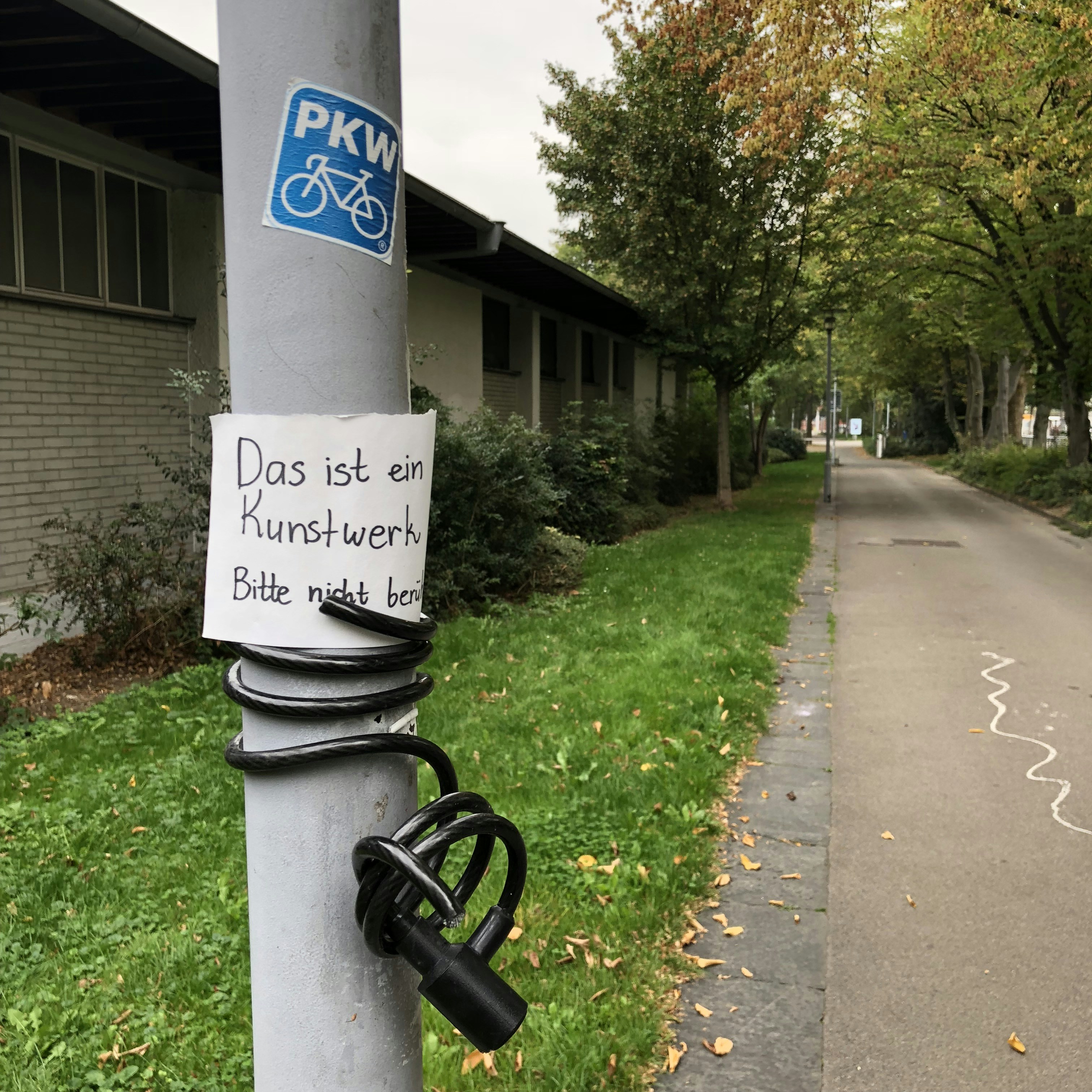 White and blue street sign.