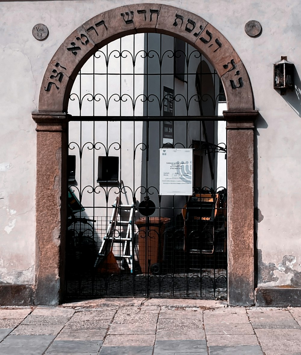 brown brick building with black metal window grill