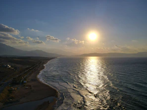 The Pacific coastline near Colima at golden hour, waves gently meeting the shore.