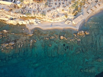 aerial view of people on beach during daytime VIP van services Mykonos safety 2026
