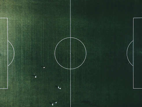 silver round ornament on green textile