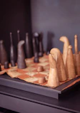 brown wooden rolling pin on brown wooden board