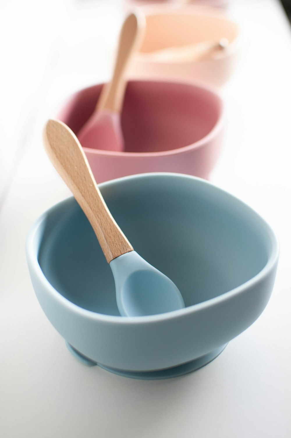 white ceramic bowl with silver spoon