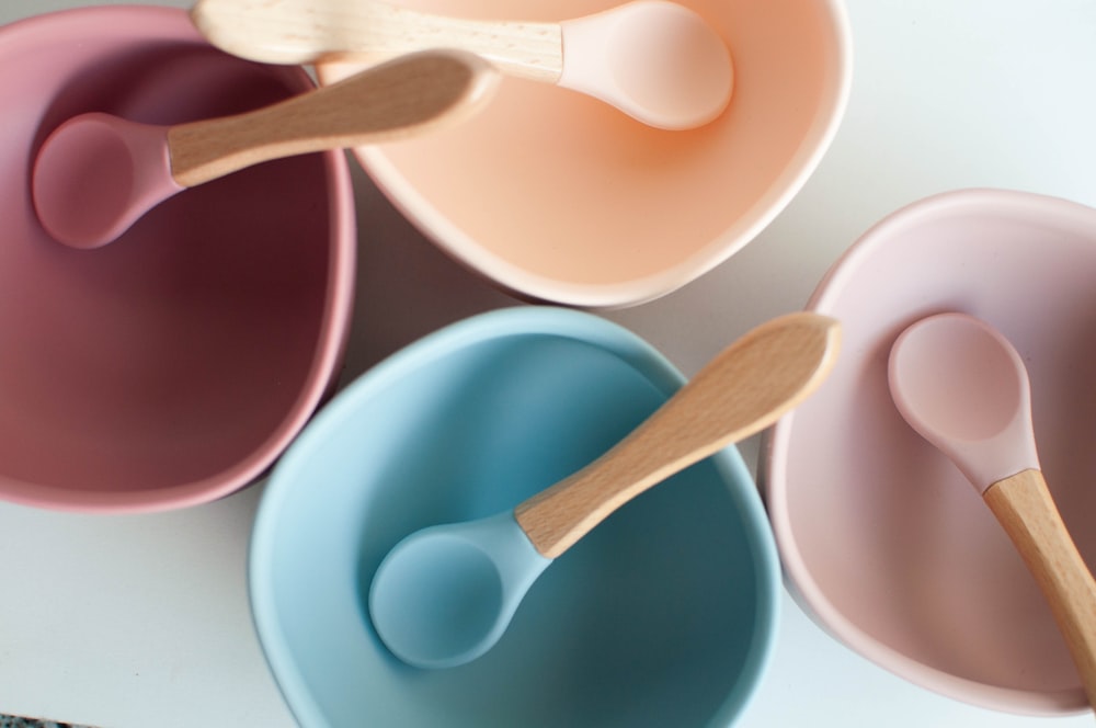 brown wooden spoon in blue ceramic bowl