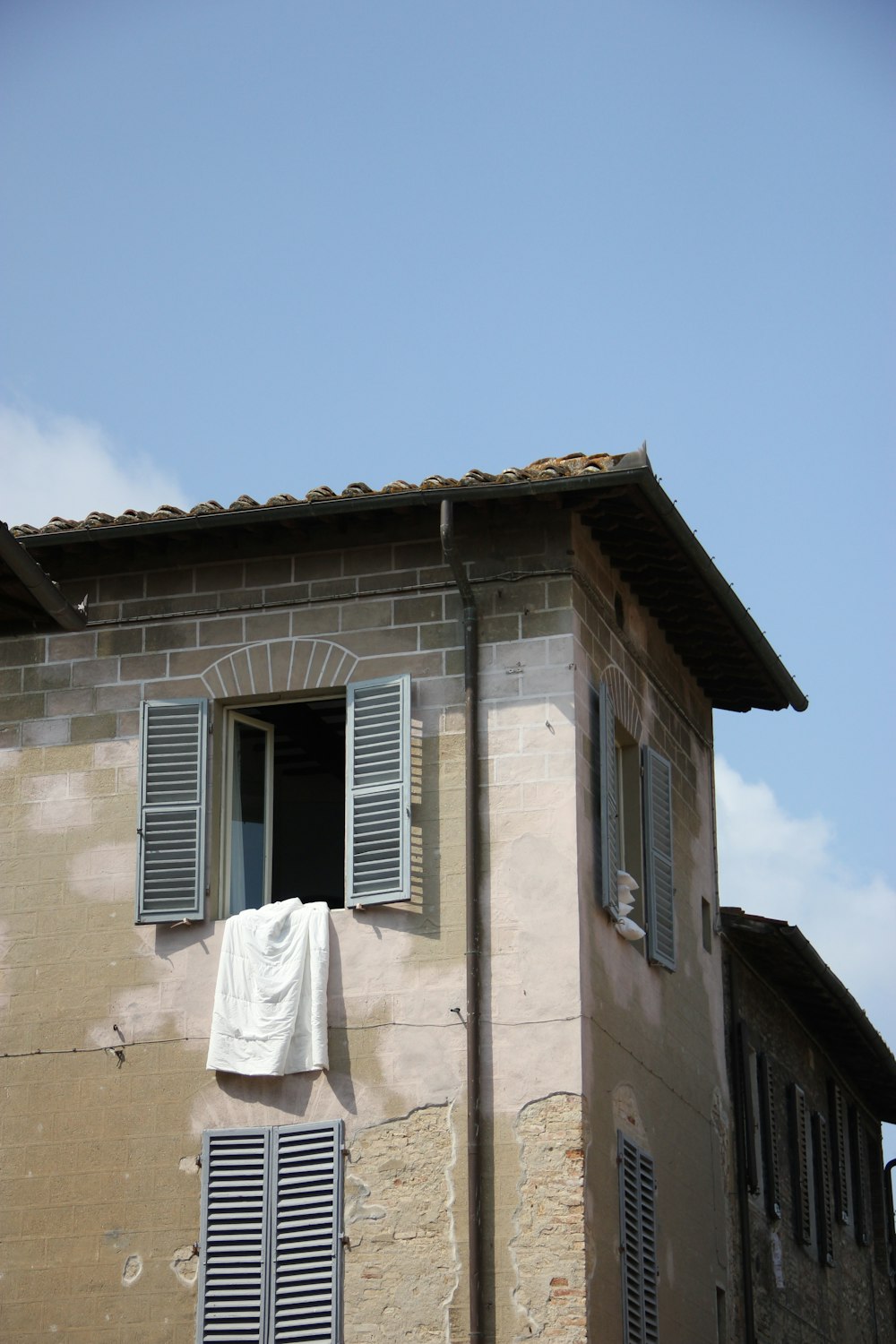 brown concrete building under blue sky during daytime