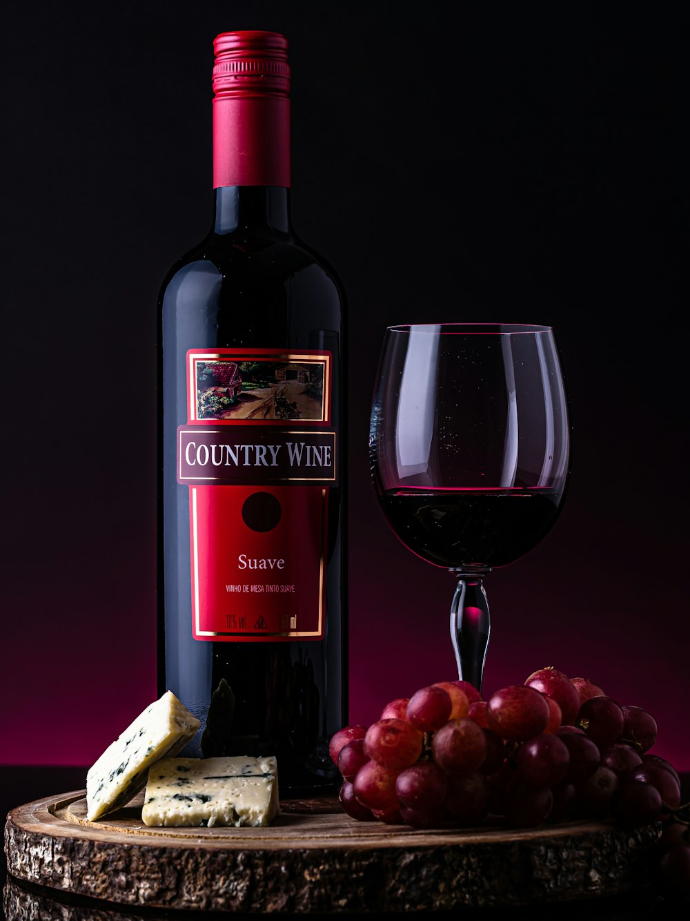 red wine bottle beside wine glass
