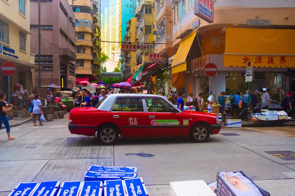 red car on road during daytime