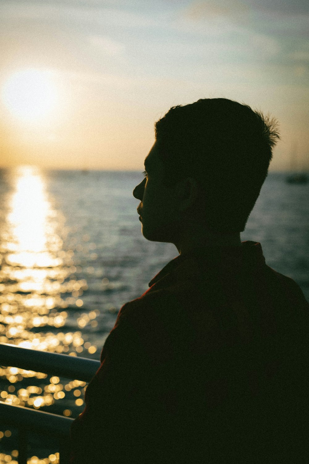 silhouette of man wearing sunglasses during sunset