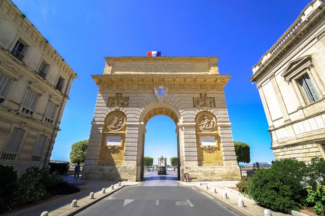 beige concrete arch under blue sky during daytime