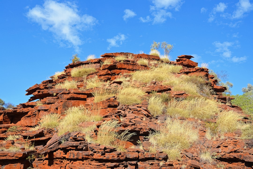 brown rock formation under blue sky during daytime