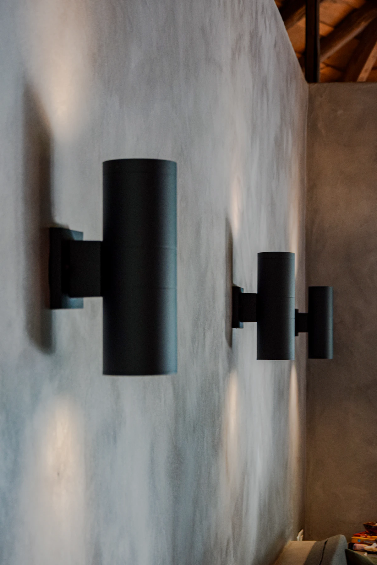 A pair of wall sconces mounted symmetrically to balance the wall