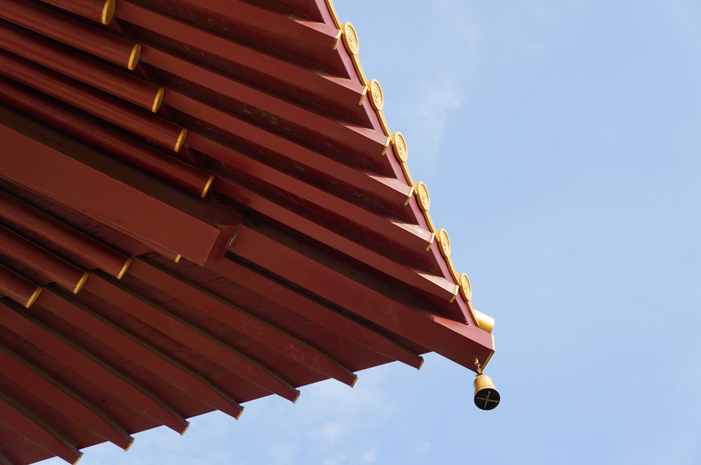 brown wooden roof under blue sky during daytime