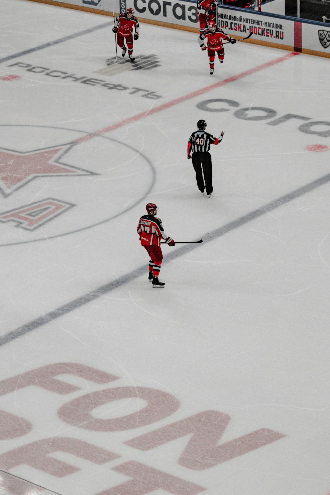 2 men playing ice hockey