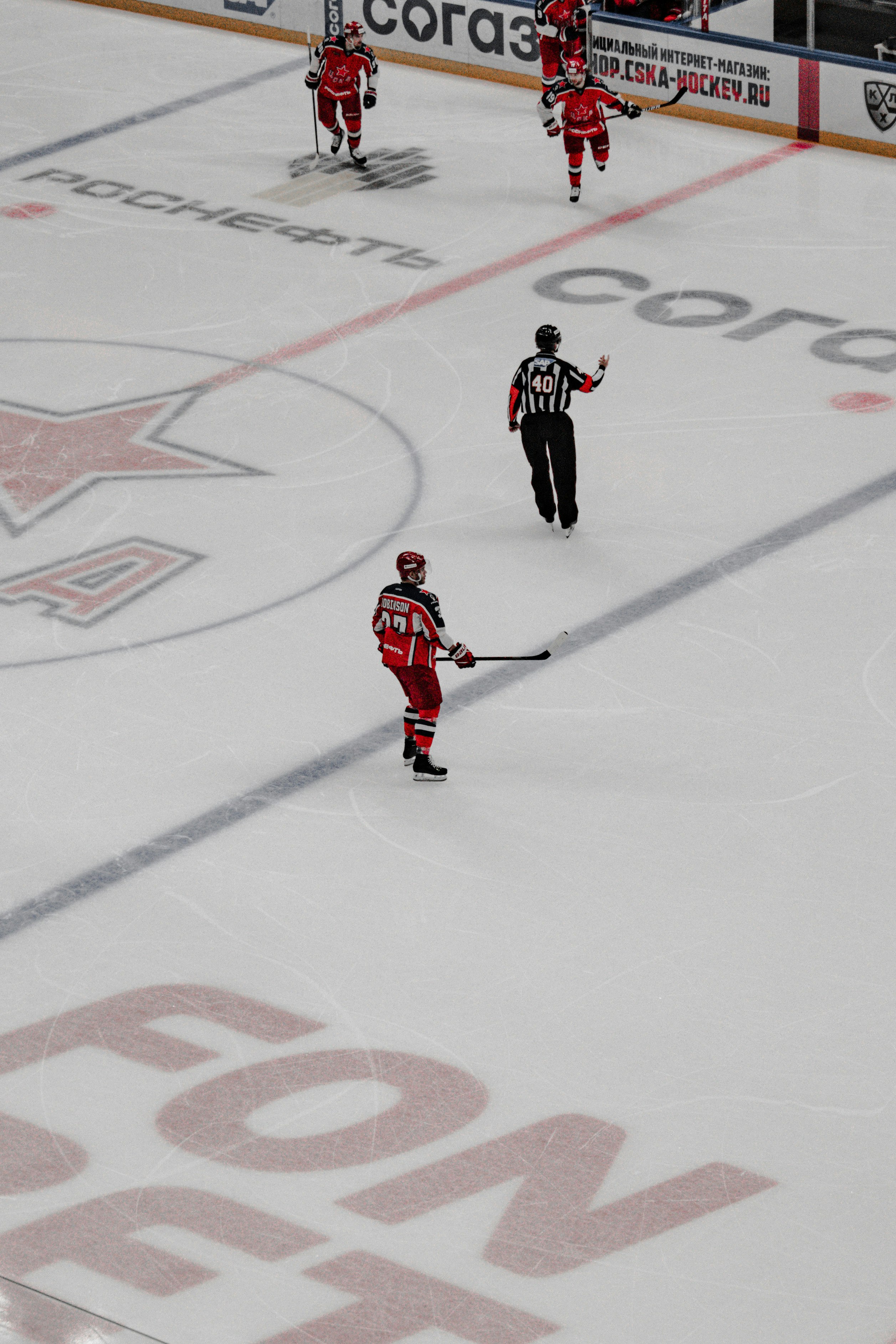 2 men playing ice hockey