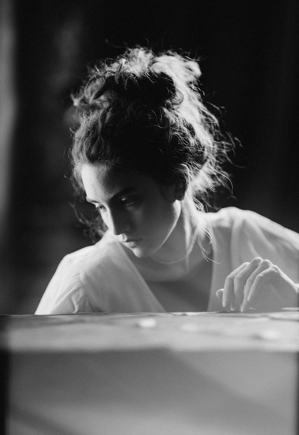 grayscale photo of woman in white shirt